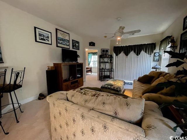 living room featuring ceiling fan and light colored carpet