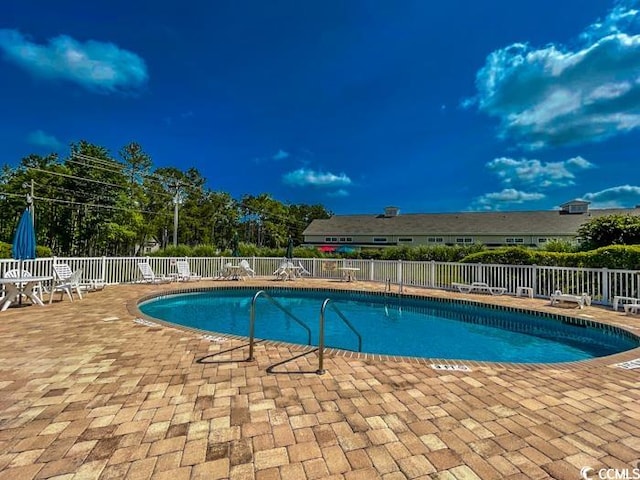 view of pool featuring a patio area