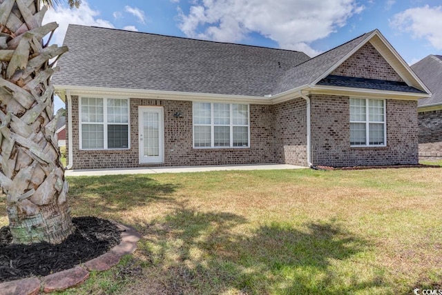 ranch-style house with a front yard