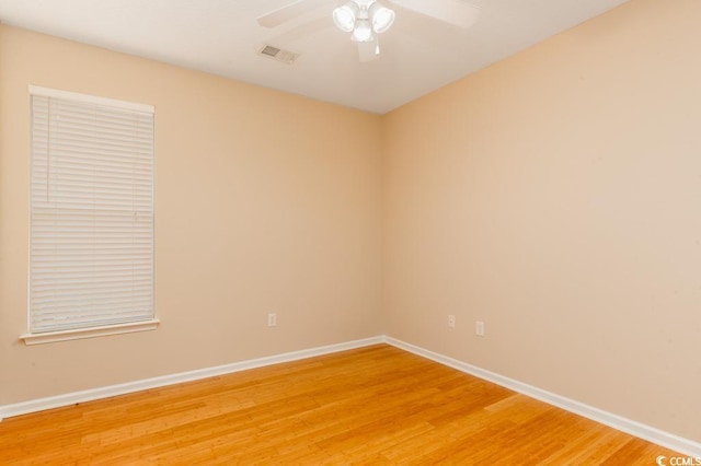 unfurnished room with hardwood / wood-style floors and ceiling fan