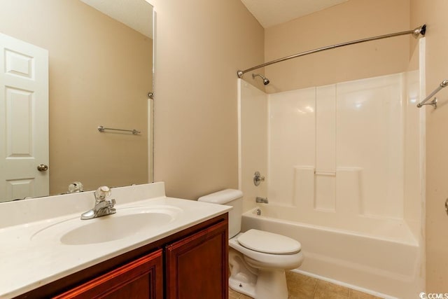 full bathroom featuring tile patterned floors, vanity, toilet, and bathtub / shower combination