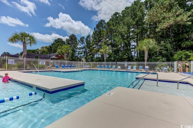 view of swimming pool with a patio area