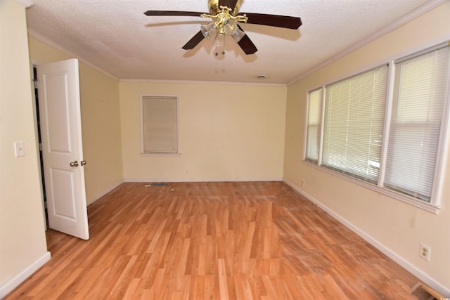 unfurnished room with a textured ceiling, light hardwood / wood-style flooring, ceiling fan, and crown molding