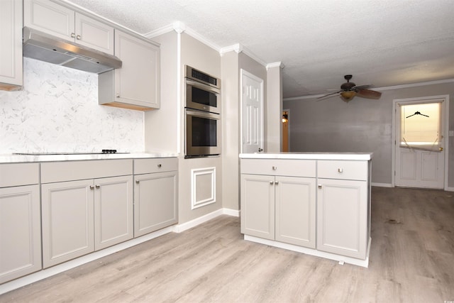 kitchen featuring a textured ceiling, ceiling fan, crown molding, and light hardwood / wood-style flooring