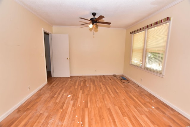 empty room with ceiling fan, light hardwood / wood-style flooring, crown molding, and a textured ceiling