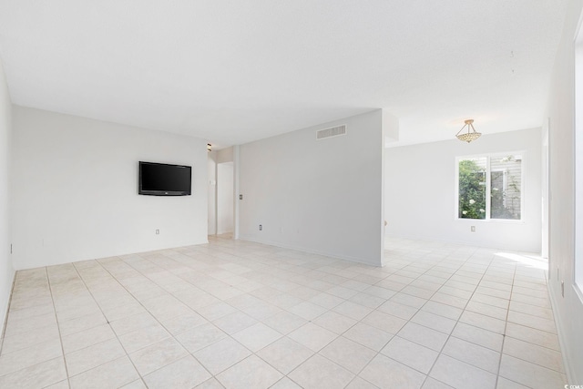 unfurnished room featuring light tile patterned floors and visible vents