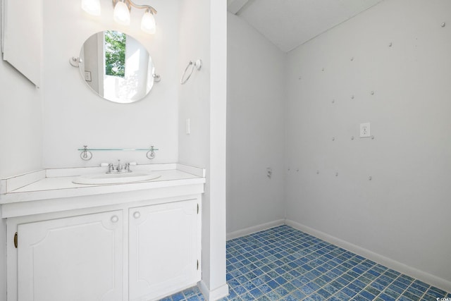 bathroom featuring vanity and baseboards