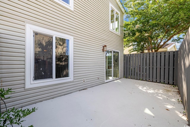 view of patio featuring fence