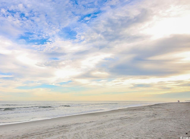 property view of water featuring a beach view