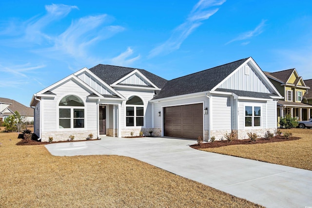 view of front facade with a garage and a front lawn