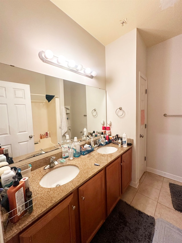 bathroom featuring tile patterned flooring and double sink vanity