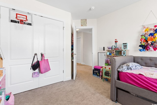 bedroom featuring light carpet