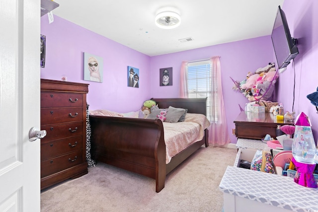 bedroom with light carpet