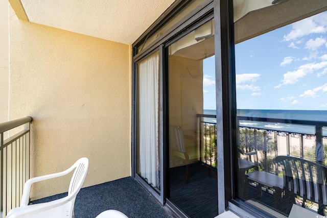 balcony featuring a water view