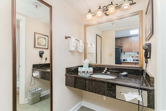 bathroom featuring tile patterned flooring and sink