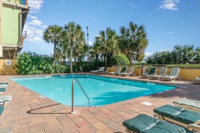 view of swimming pool featuring a patio area