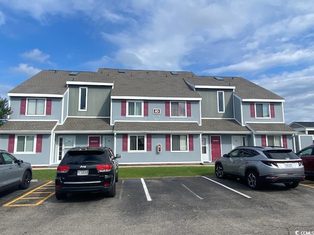 1880 Colony Dr Unit 10-H, Surfside Beach, SC 29575 - view of front of property with uncovered parking and roof with shingles