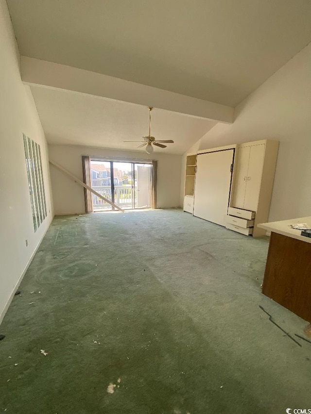 1880 Colony Dr Unit 10-H, Surfside Beach, SC 29575 - unfurnished living room featuring ceiling fan, carpet, and vaulted ceiling