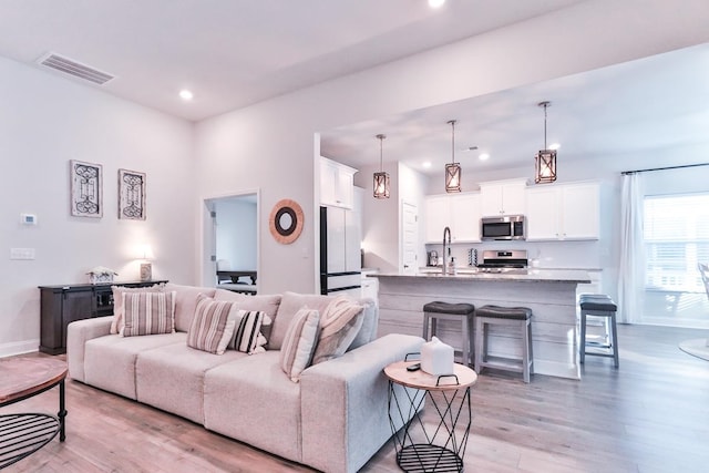 living room with light hardwood / wood-style floors