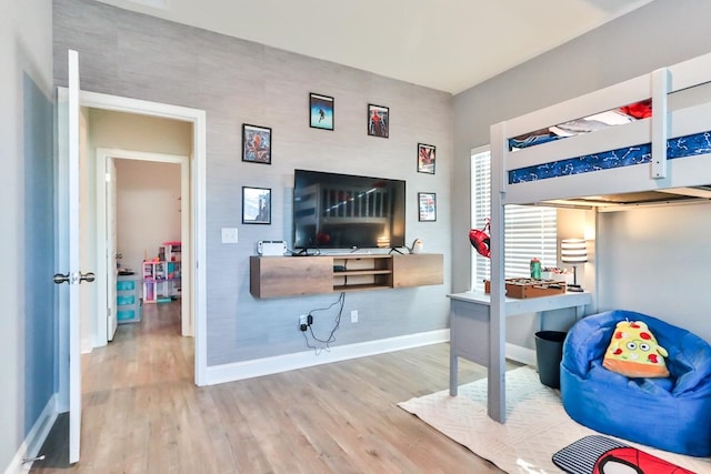 bedroom with wood-type flooring