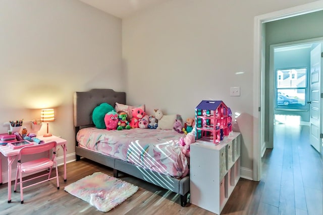 bedroom featuring wood-type flooring