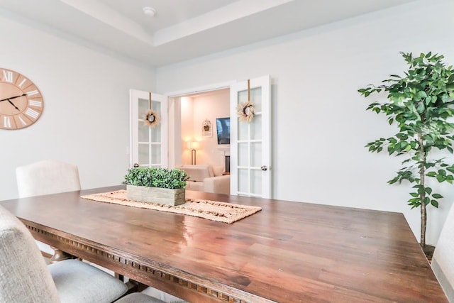 dining room featuring a tray ceiling