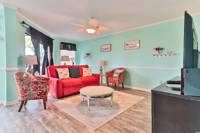 living room featuring ornamental molding, ceiling fan, and hardwood / wood-style floors