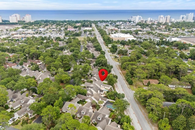 birds eye view of property featuring a water view and a view of city