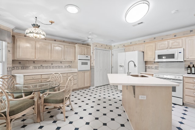 kitchen featuring white appliances, crown molding, light brown cabinets, and light floors