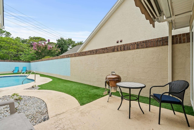 view of patio / terrace featuring a fenced in pool