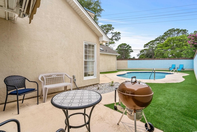 view of pool featuring a fenced in pool, a patio area, a lawn, and a fenced backyard