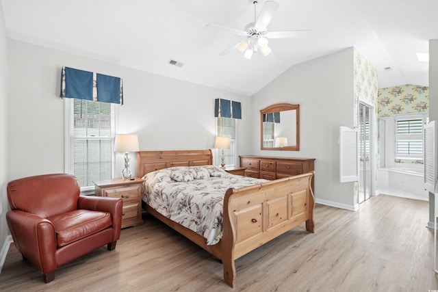 bedroom featuring light hardwood / wood-style floors, ceiling fan, and lofted ceiling