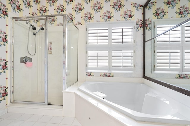 full bathroom featuring a stall shower, tile patterned floors, a bath, and wallpapered walls