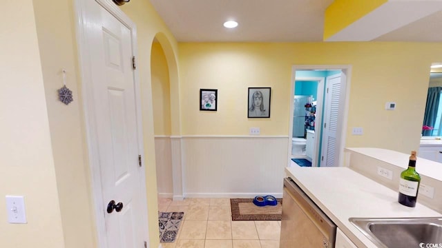 bathroom with tile patterned flooring and toilet