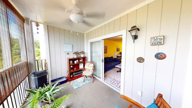 sunroom featuring ceiling fan