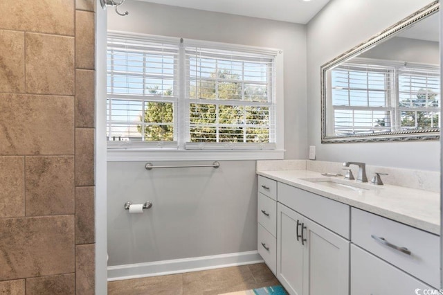 bathroom with tile patterned flooring and vanity