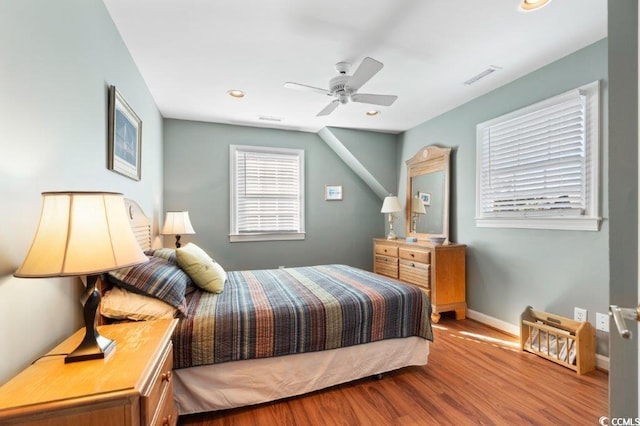 bedroom featuring hardwood / wood-style floors and ceiling fan