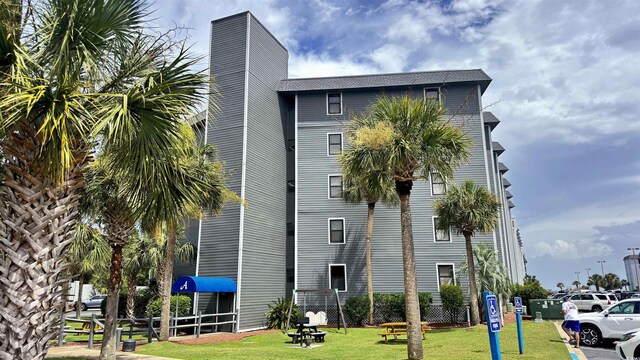 view of building exterior with fence