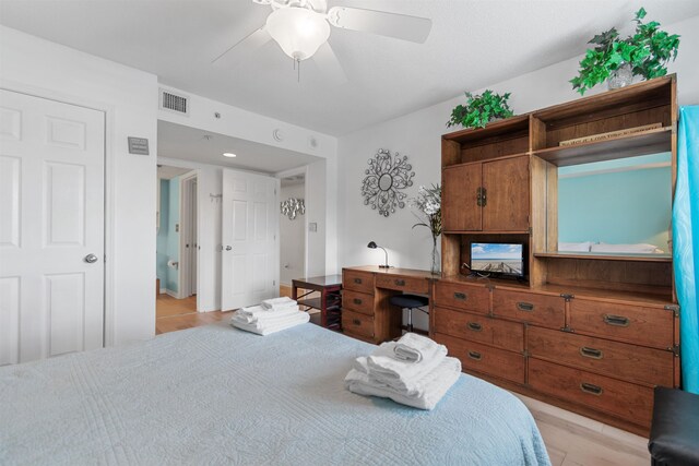 bedroom with ceiling fan and light wood-type flooring