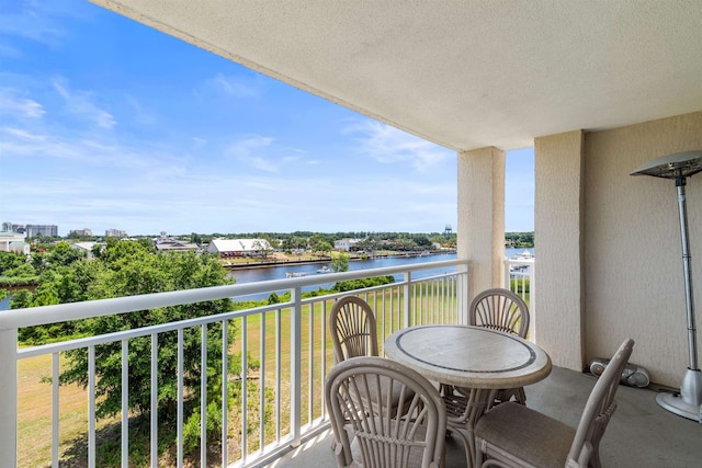 balcony featuring a water view