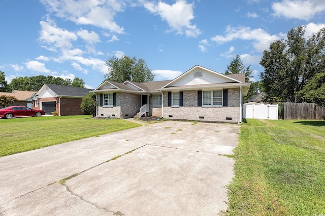 ranch-style house featuring a garage and a front lawn