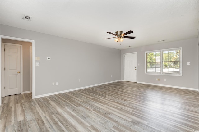 spare room with ceiling fan and light hardwood / wood-style flooring