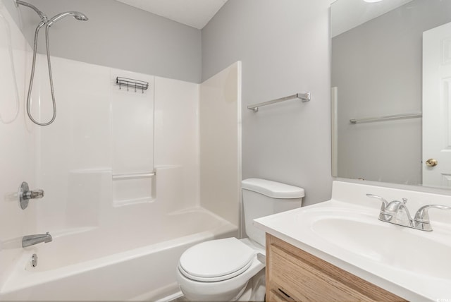 full bathroom with washtub / shower combination, vanity, and toilet