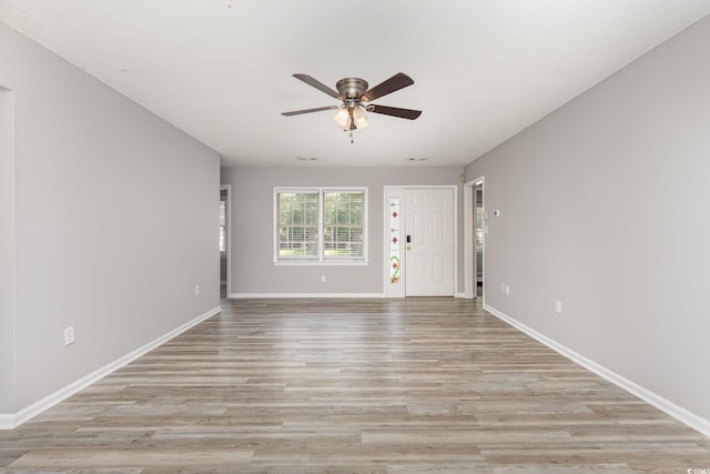 unfurnished living room with light hardwood / wood-style floors and ceiling fan