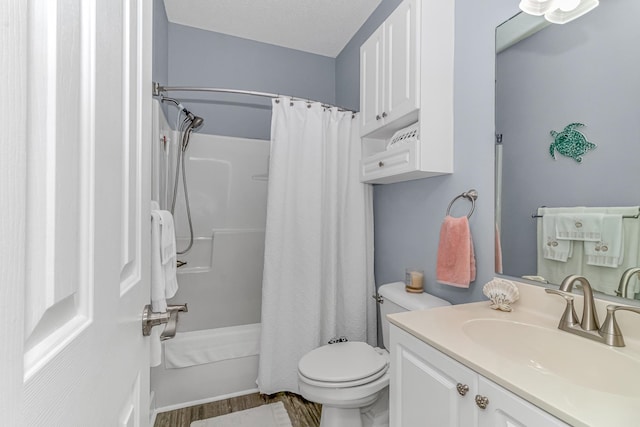 full bathroom featuring a textured ceiling, toilet, vanity, shower / tub combo with curtain, and hardwood / wood-style floors