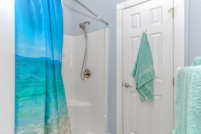 bathroom with a shower with shower curtain