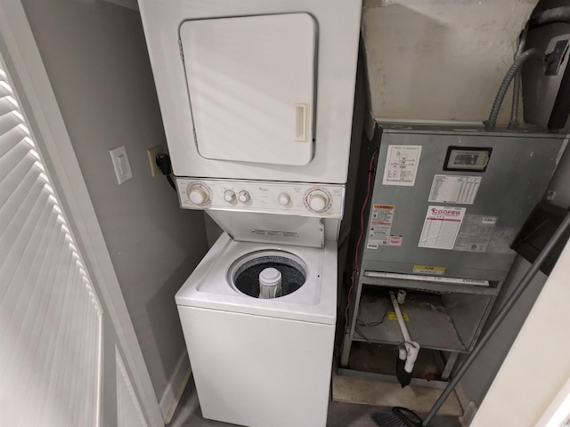 laundry area with stacked washer and dryer