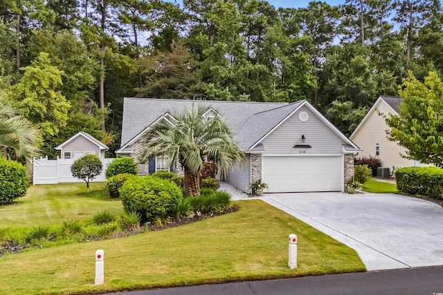 view of front of house featuring a front lawn and a garage