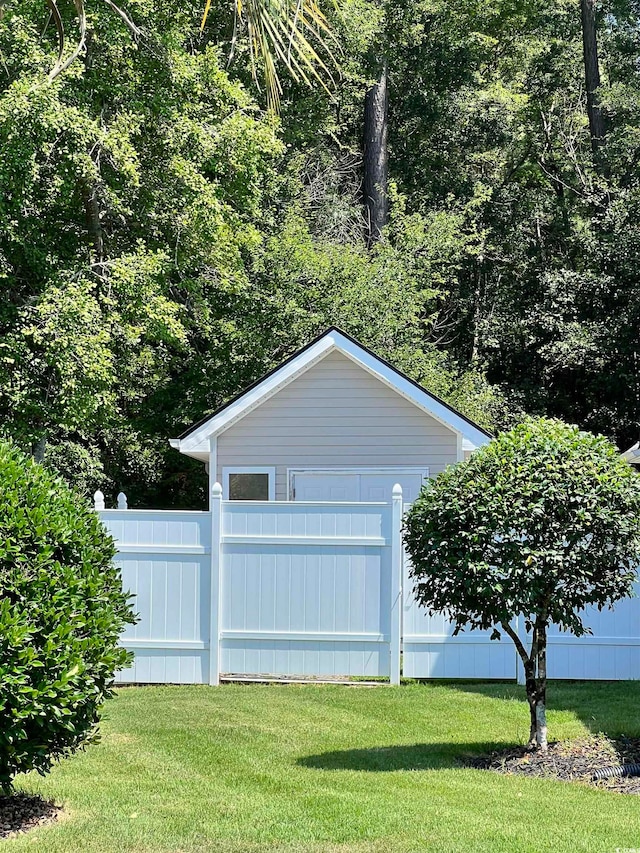 garage with a yard