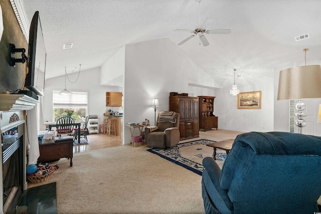 living room featuring light colored carpet, high vaulted ceiling, a textured ceiling, and ceiling fan